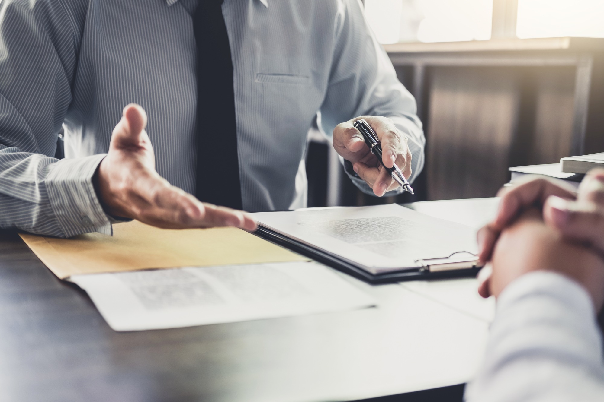 Businessman and Male lawyer or judge consult having team meeting with client, Law and Legal services concept.; Shutterstock ID 1043656987; Purchase Order: Bulk License 2/25/2019; Job: ; Client/Licensee: ; Other: